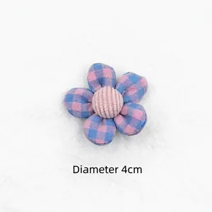 Detail view of a 4cm diameter pink and blue checkered fabric flower for DIY hair accessories
