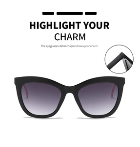 Detailed view of cat eye sunglasses hinge with purple gradient lenses and black frames