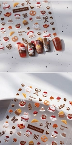 Detail of 3D embossed rabbit and autumn bread nail stickers with warm caramel tones