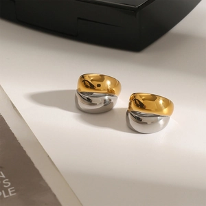 Two-tone stainless steel ear cuff earrings in gold and silver with a modern sleek design