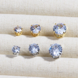 Classic four-prong round zircon earrings set in gold and silver plating and varied sizes