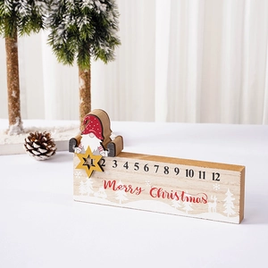 Detail of wooden Christmas countdown calendar with movable gnome and Merry Christmas text