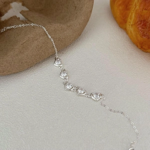 Minimalist S925 sterling silver chain bracelet with five sparkling heart-shaped zircons