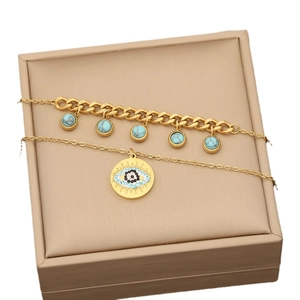 Golden double-layer stainless steel jewelry set with blue evil eye heart pendant