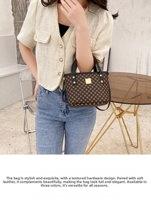 Close-up of stylish brown bucket bag with geometric patterns and gold rivet details