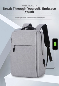 Macro view of gray business laptop backpack featuring an external USB charging port