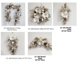 Detail of Christmas wreath styles with pine cones, magnolia flowers, and champagne balls