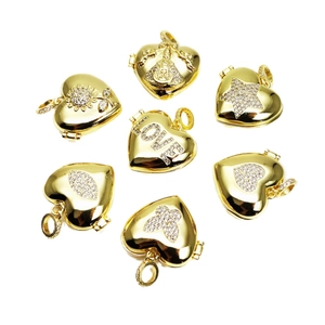 Gold heart lockets with cubic zirconia sunflower and LOVE charms on white background