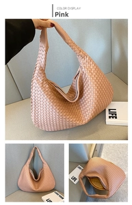Detail view of pink woven leather shoulder bag with large lattice pattern and top zipper