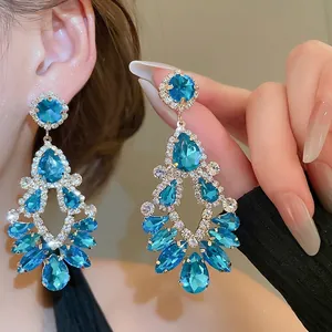 Elegant gold drop earrings with blue crystals and tassels for women's fashion jewelry