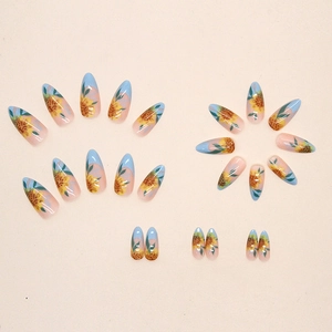 Almond sunflower press-on nails with blue gradient design and glossy finish
