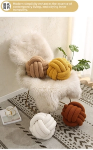 Detailed texture of handcrafted knot pillows in soft sherpa fabric for home decor
