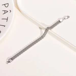 Detail of silver multi-strand metal chain bracelet with a secure lobster clasp closure