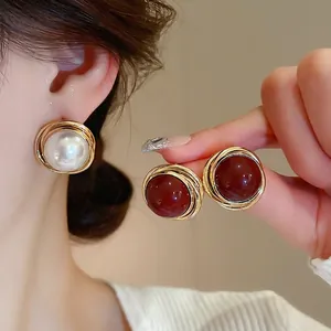 Retro round pearl stud earrings with gold wire wrap in white and burgundy finishes
