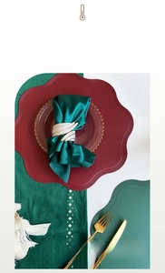 Detail of red and green leather placemats with heat-resistant and waterproof texture