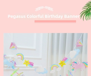 Close-up of holographic unicorn birthday banner with rainbow and star paper cutouts