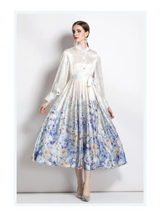 Detail of the high-neck lantern sleeve and blue floral print on the satin dress