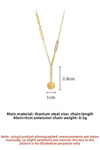 Macro detail of gold-plated titanium steel necklace with matte bead and oval links