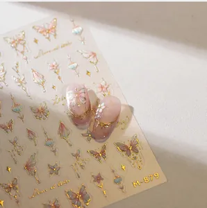 Close-up of M-879 nail art stickers with golden butterfly and floral patterns
