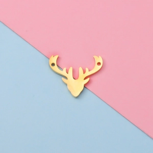 Detailed view of golden stainless steel deer head pendant with dual connection holes