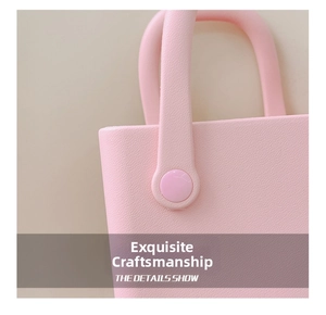 Detail der rosa EVA-Strandtasche mit verstärkten runden Griffverschlüssen und Textur