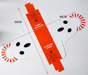 Flat lay of unassembled Halloween pumpkin ghost candy box with dimensions 39cm and 46cm