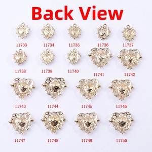 Macro view of gold alloy crystal heart pendants showing reverse side hollow details