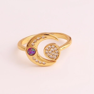 Detail of gold moon ring with pavé diamonds and a round purple opal stone setting