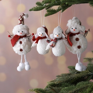 Set of four plush Christmas snowman hanging ornaments on evergreen pine branches