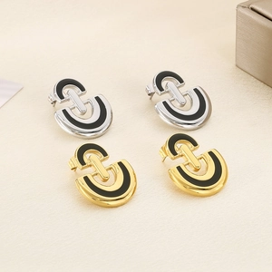 Elegant D-shaped stainless steel earrings with black enamel inlay in gold and silver finish