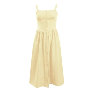 Détail d'une robe d'été jaune pâle sans manches avec une rangée de boutons sur le devant