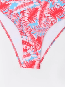 Close-up of tropical leaf print bikini bottom with high-cut leg and white inner lining