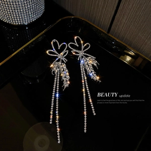 Silver fringe tassel earrings with rhinestones and wheat leaf bow design in luxury style