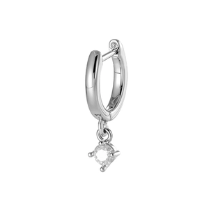 Minimalist silver geometric hoop earring with round clear gemstone pendant on white backdrop