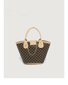 Detailed close-up of retro geometric patterned tote bag with gold chain and leather trim
