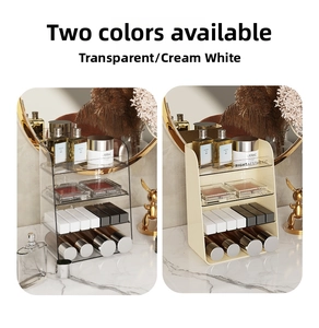 Three-tier cosmetics organizer display in transparent and cream white on marble surface