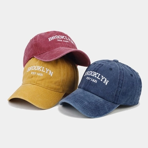 Detailed embroidery of BROOKLYN EST 1631 on vintage washed cotton baseball caps