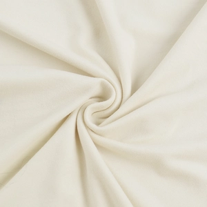 Detailed macro view of soft cream-white knitted fabric texture and elegant pleated draping
