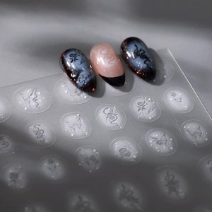 Gothic nail art stickers with snakes and roses on matte black and nude glitter press-ons