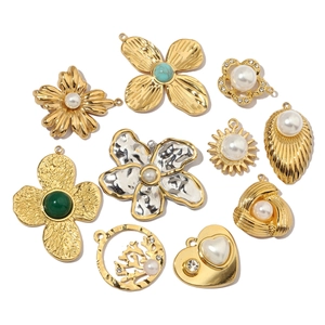 Collection of vintage gold plated DIY floral and heart charms with pearls and stones