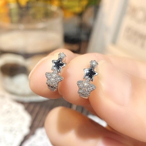 Minimalist silver star hoop earrings for women with inlaid zircon and black star detail