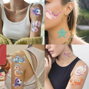 Detailed views of waterproof cartoon ocean animal temporary tattoos on kids skin