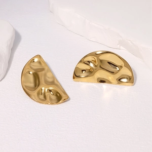 Golden semi-circle stud earrings with hammered irregular texture and metallic finish