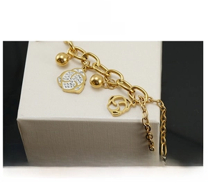 Detail of gold-plated rose bracelet with white enamel and sparkling inlaid crystals