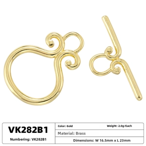 Detail of 18K gold-plated brass OT toggle clasp with engraved scroll textures