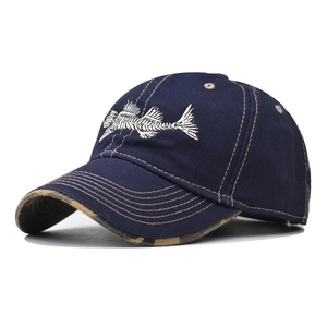 Detail of fish bone embroidery on navy baseball cap with camouflage under-brim design