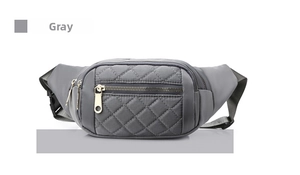 Detail of grey quilted nylon waist bag showing silver zippers and adjustable strap