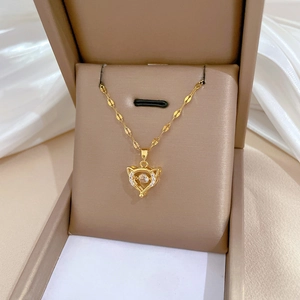 Luxury titanium steel necklace with a rotating diamond-encrusted cat pendant in gold