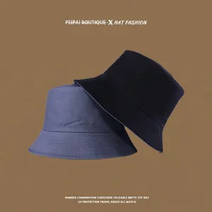 Close-up of a foldable reversible sun hat with wide brim and reinforced stitching detail