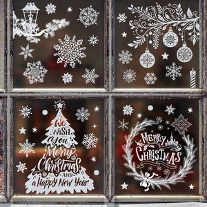 White Christmas window static stickers featuring snowflakes and trees on a glass window